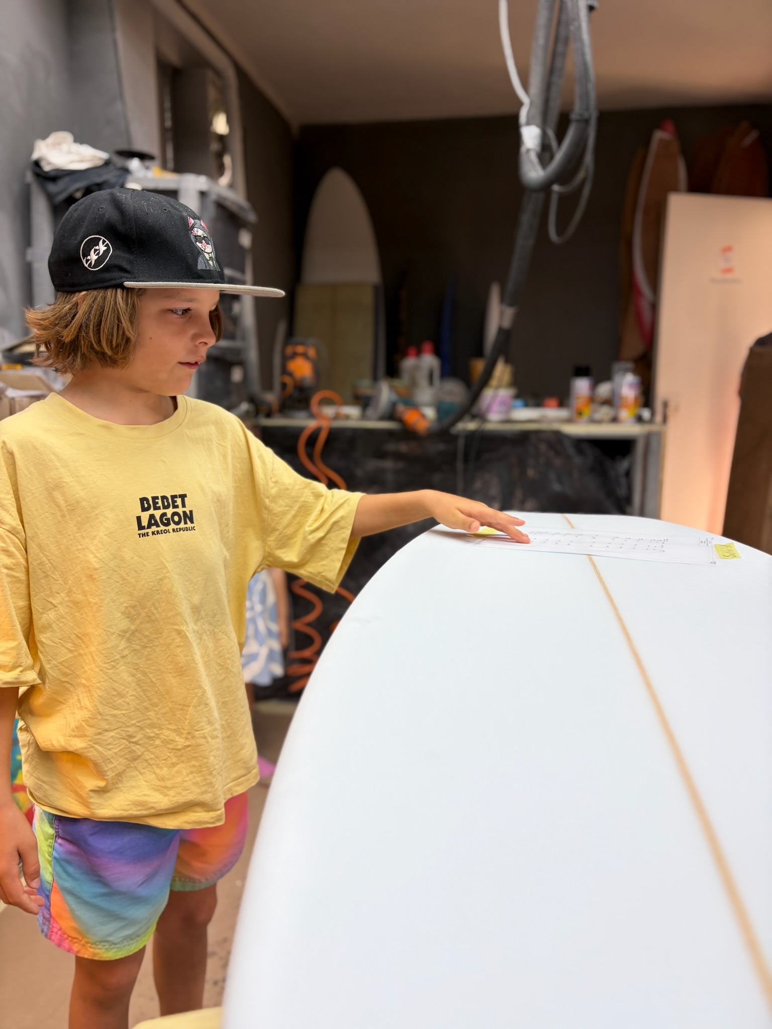 Noah looking down the outline of the blank before any foam comes off