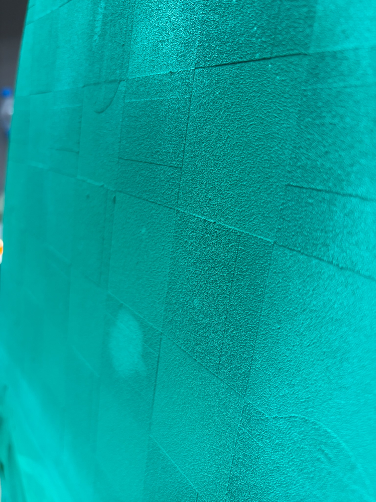 The teal checkerboard tail up close after spraying