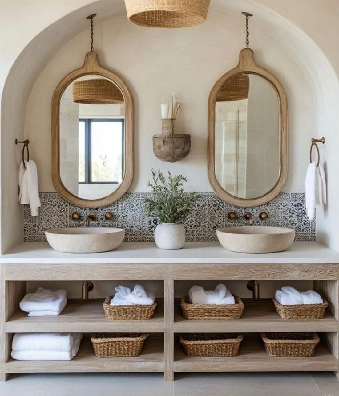 Double vanity with arched mirrors and patterned tile
