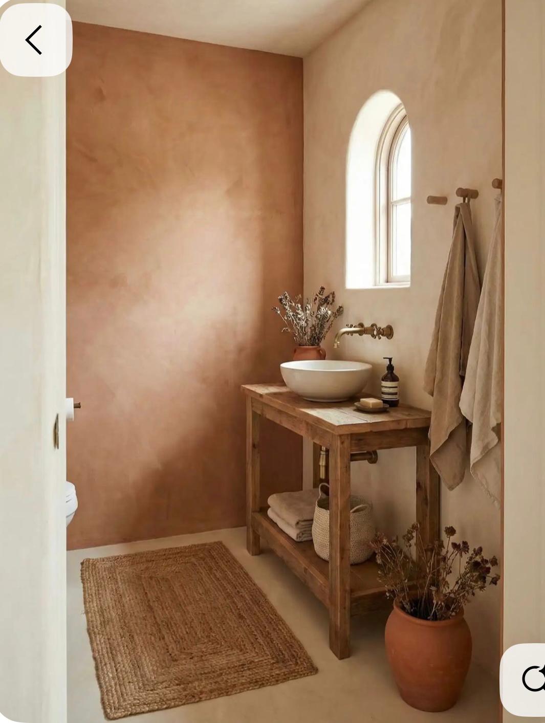 Terracotta washed wall with wooden console sink