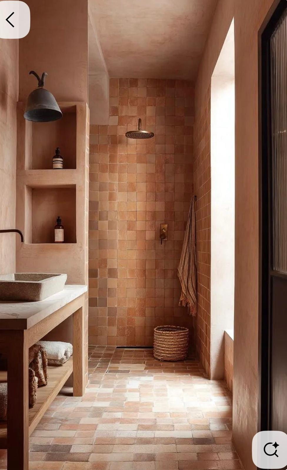 Terracotta zellige shower with built-in niches