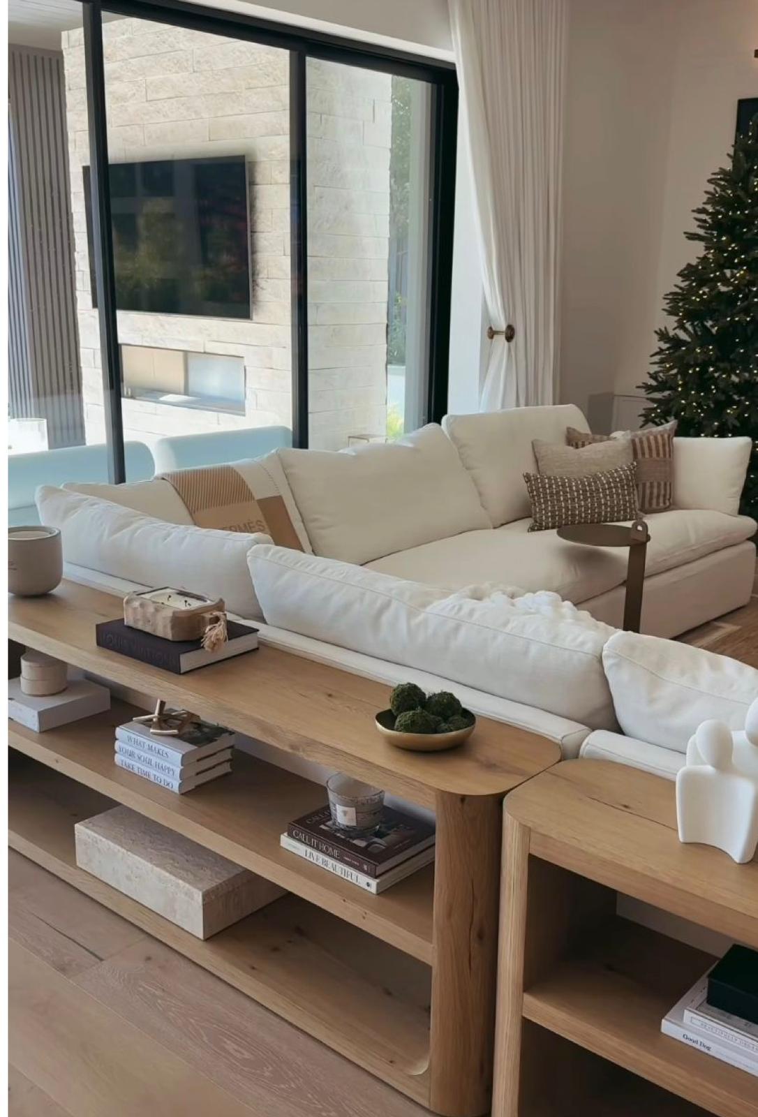 Cream sofa with wooden shelf console behind