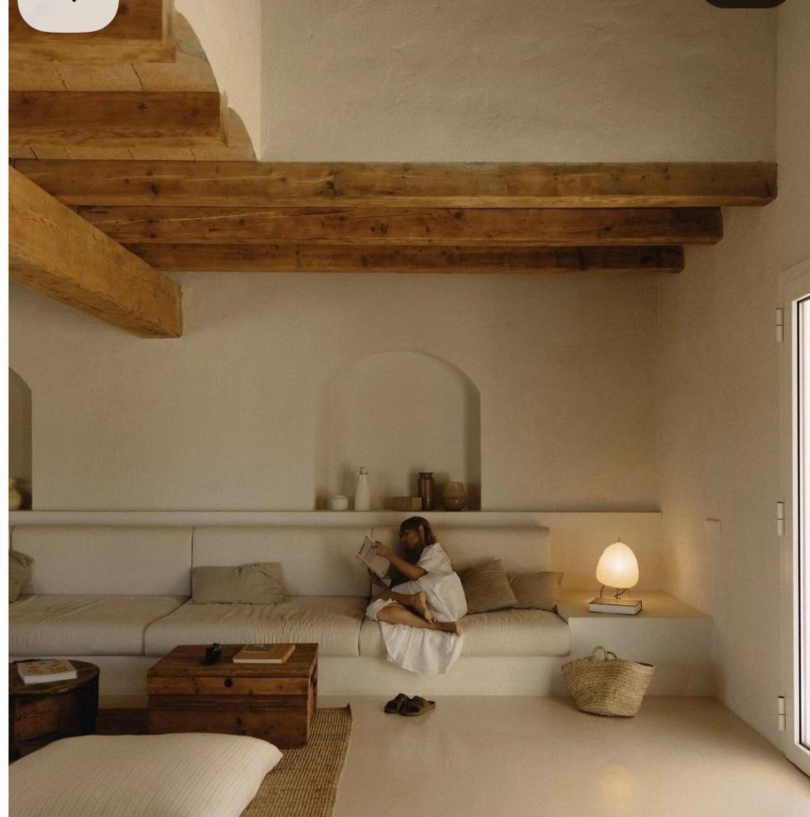 Mediterranean built-in plaster sofa under exposed beams