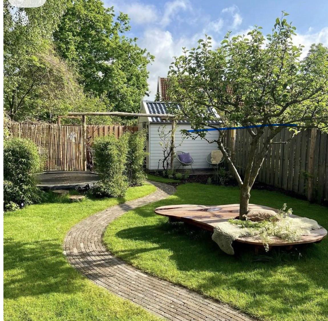 Curved path with wrap-around tree bench and swing