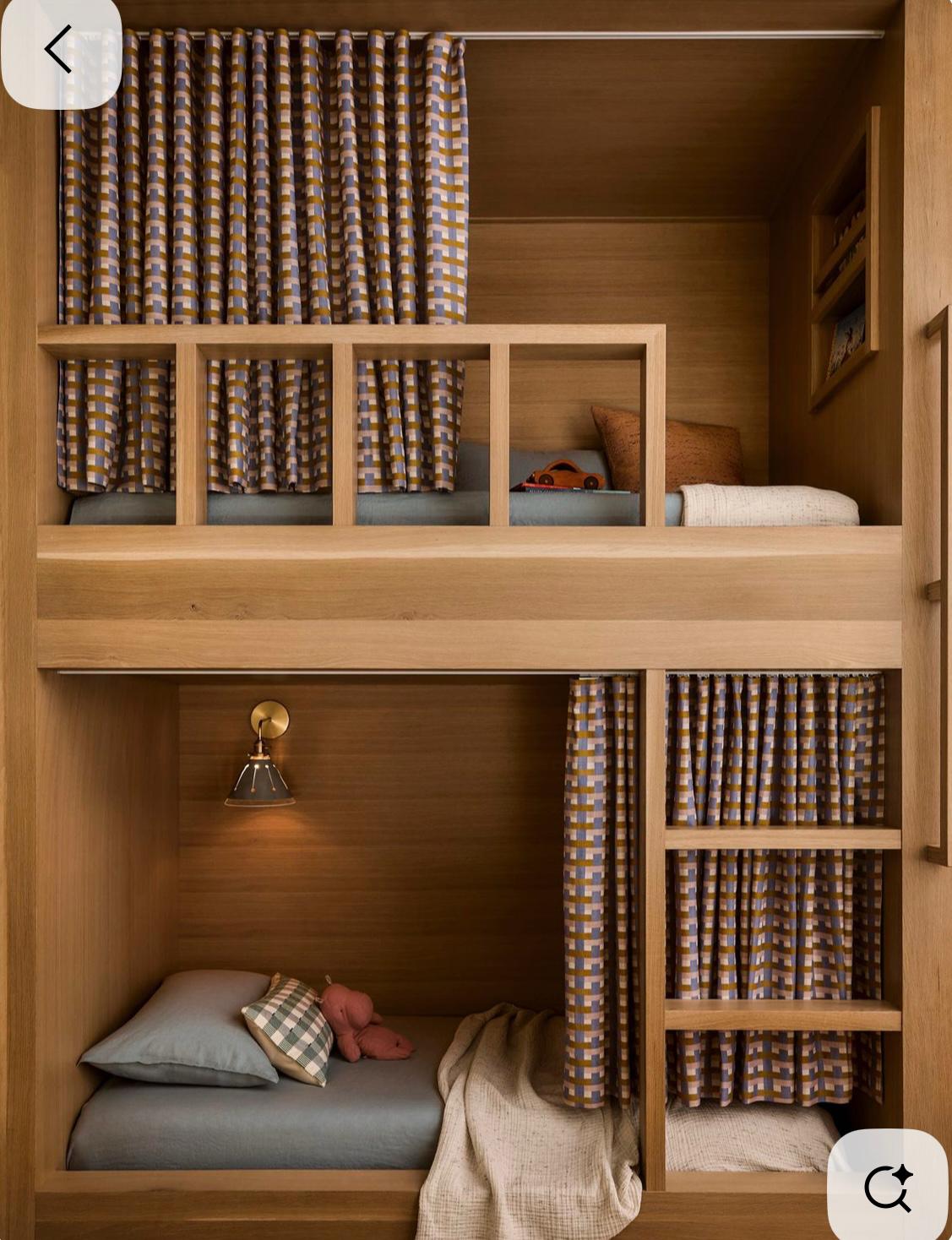 Built-in bunk with patterned curtains and cubbies