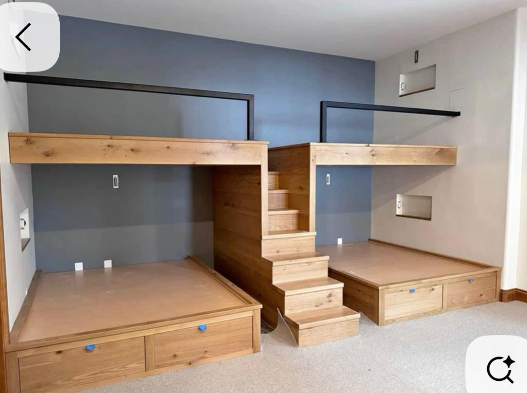 Four built-in bunks with blue accent wall