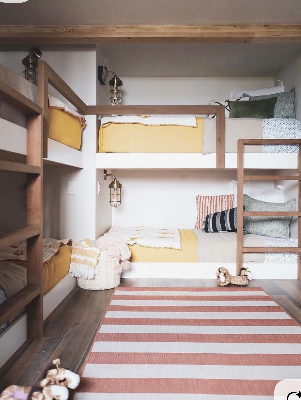 Four built-in bunks with nautical lights and colour