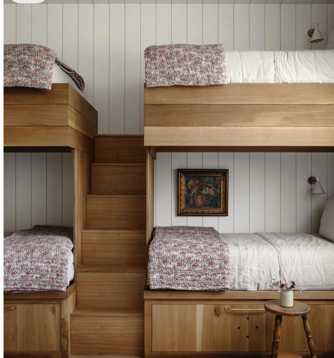Oak bunk with stairs and floral quilts