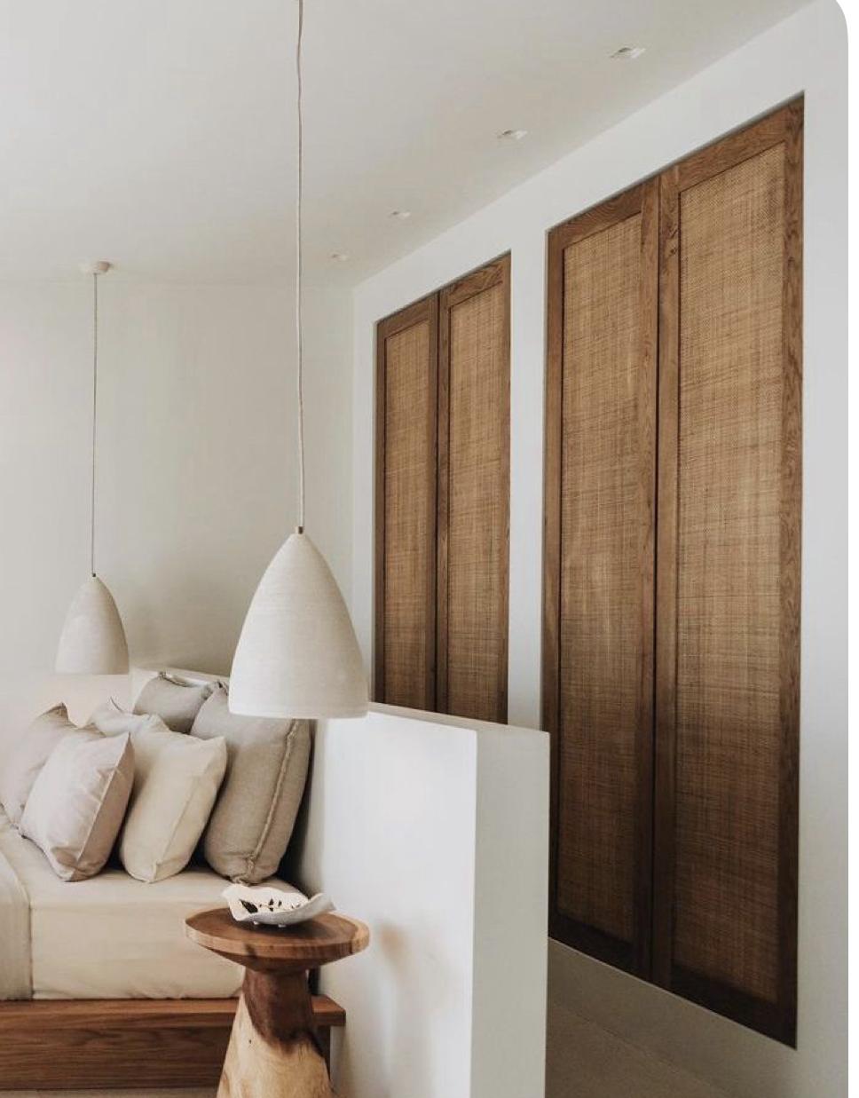 Wabi-sabi kitchen with rattan panel doors and linen seating