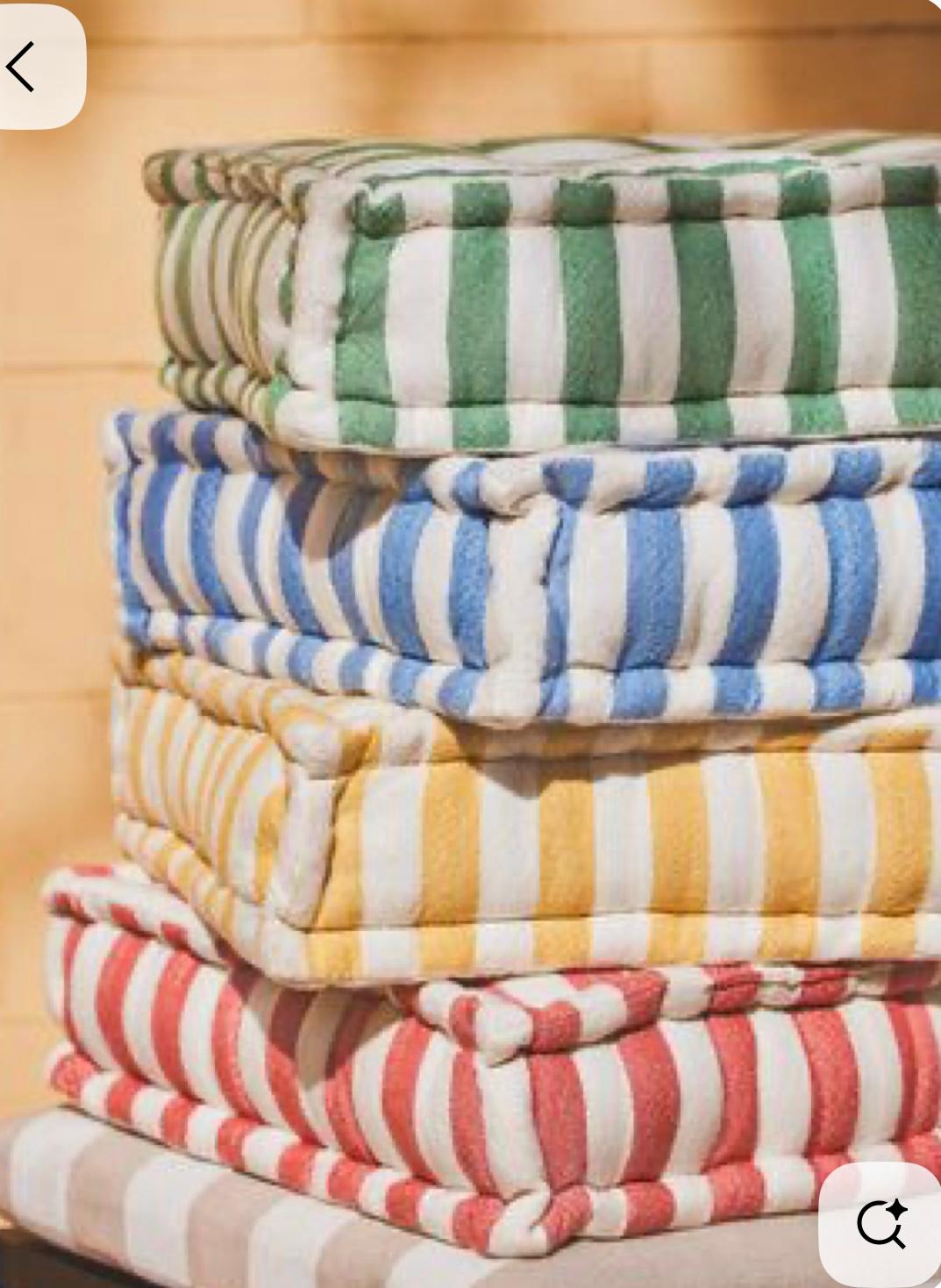Stack of colourful striped floor cushions