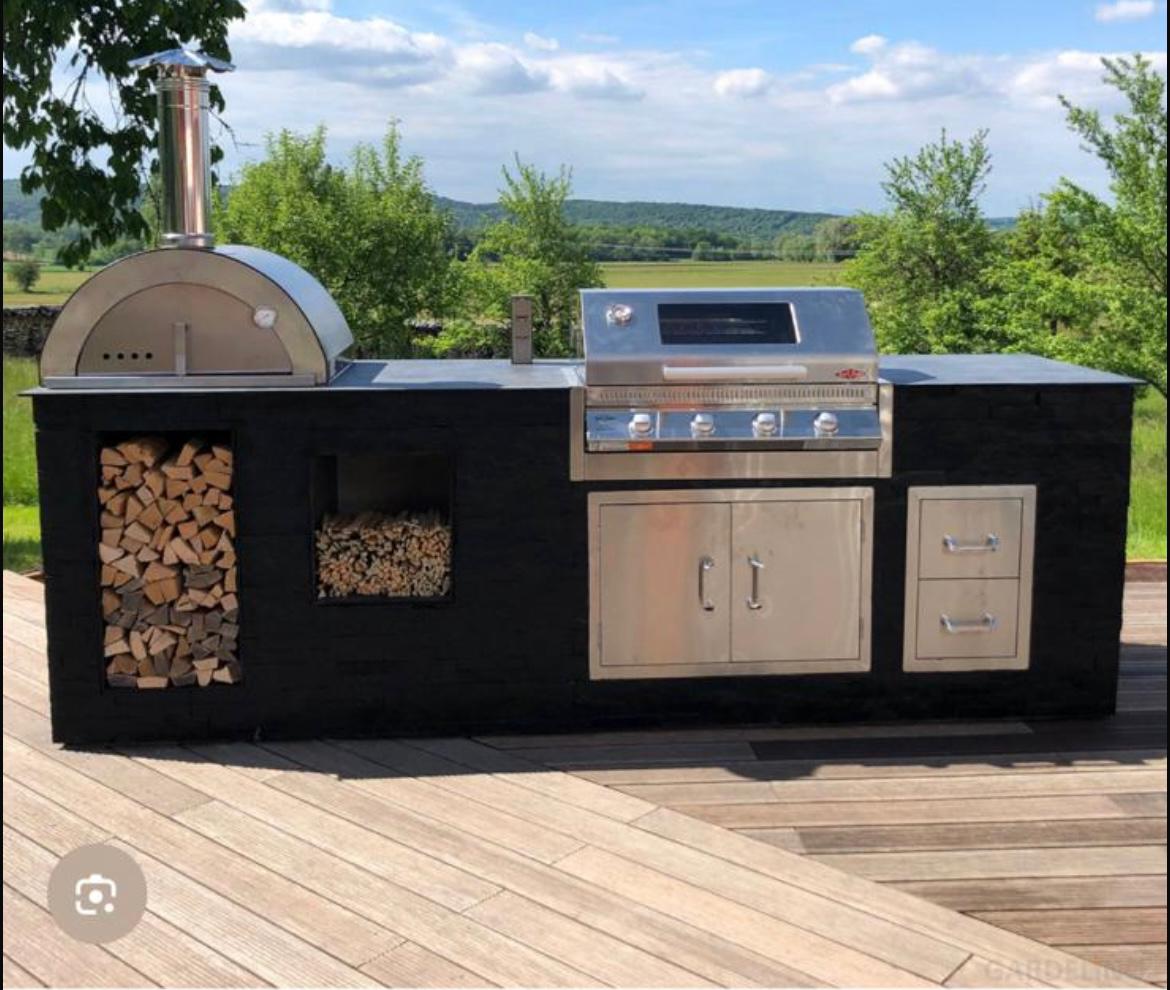 Outdoor kitchen island with pizza oven and gas grill