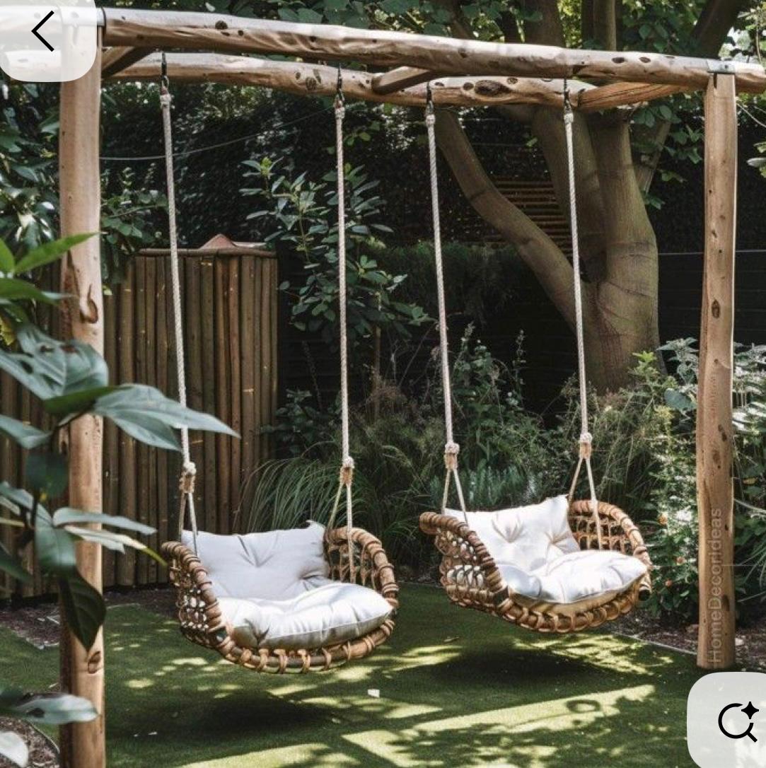 Pair of rattan swing chairs on a standalone frame