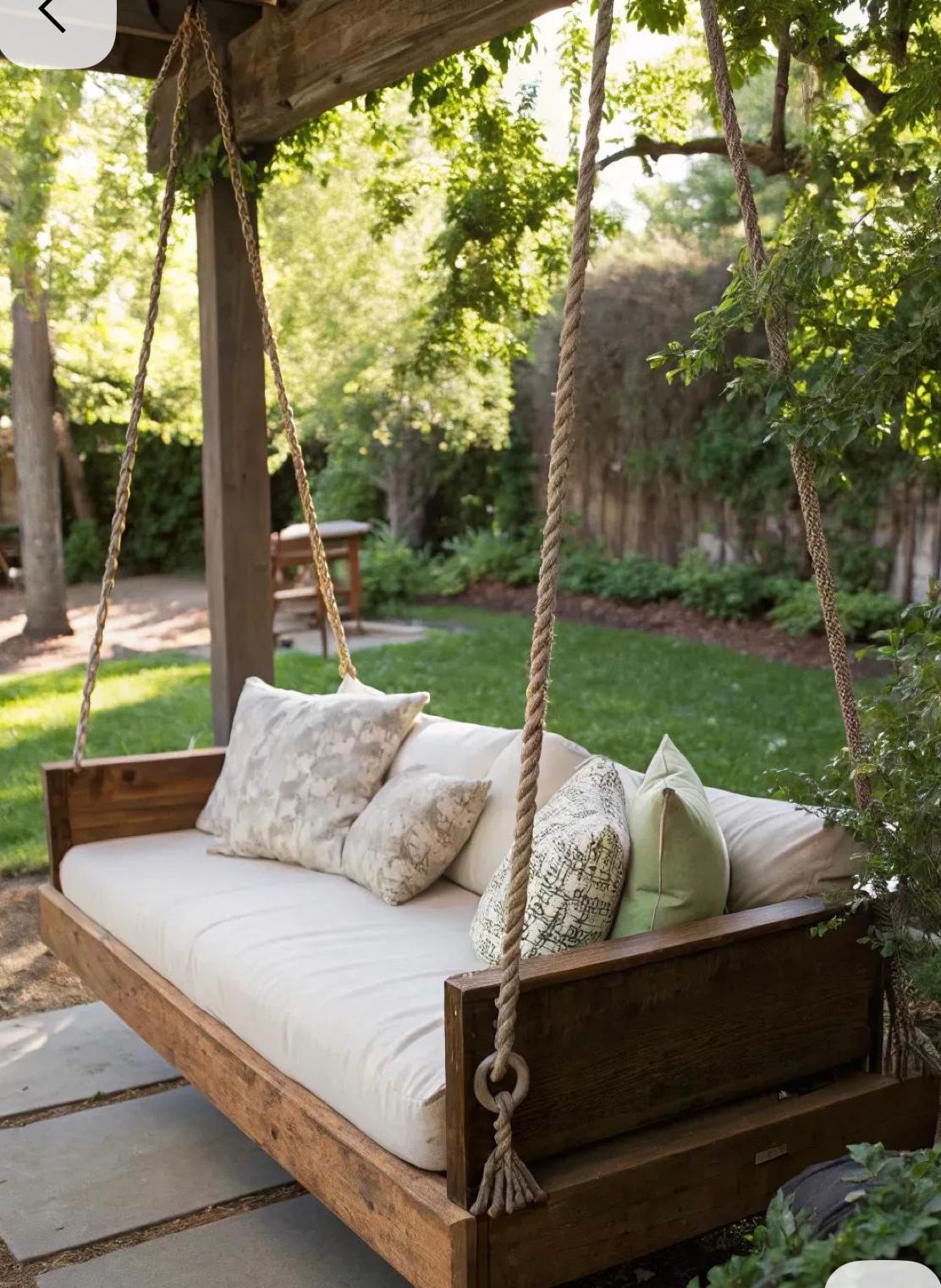 Rope swing daybed hanging under pergola